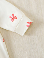 【Baby Girl Bowknot Romper】Autumn & Winter Style: Cream Base with Fuchsia Bowknot Print, featuring a doll collar and large bowkno
